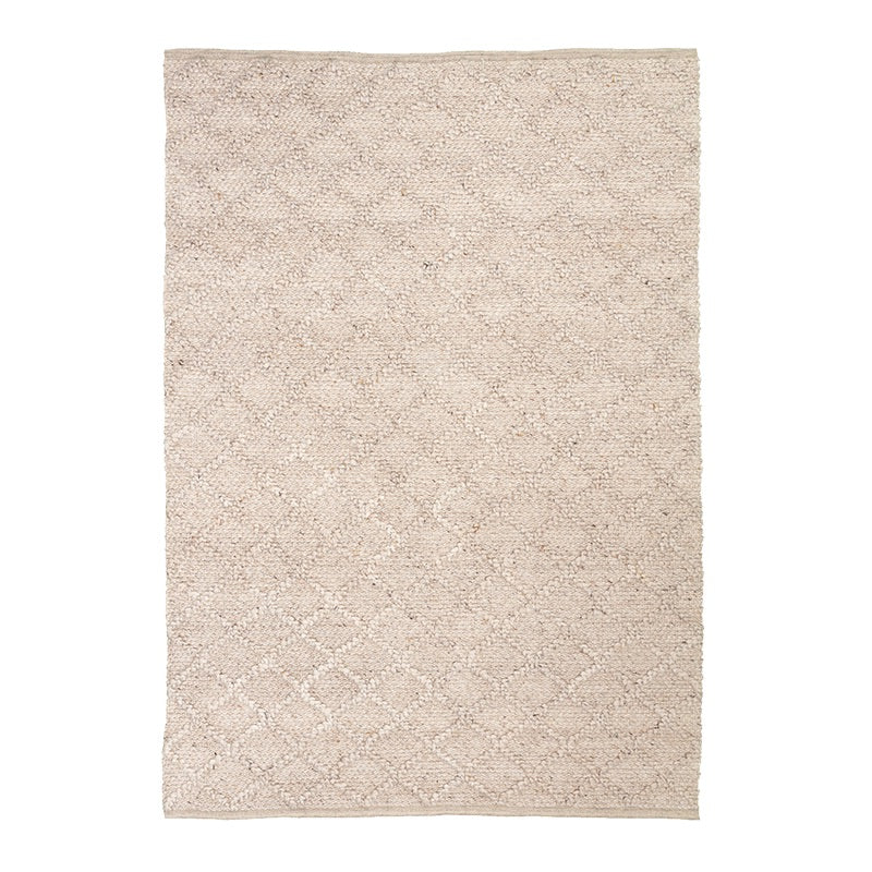 Vävd matta i ull | Knit beige hos Volero